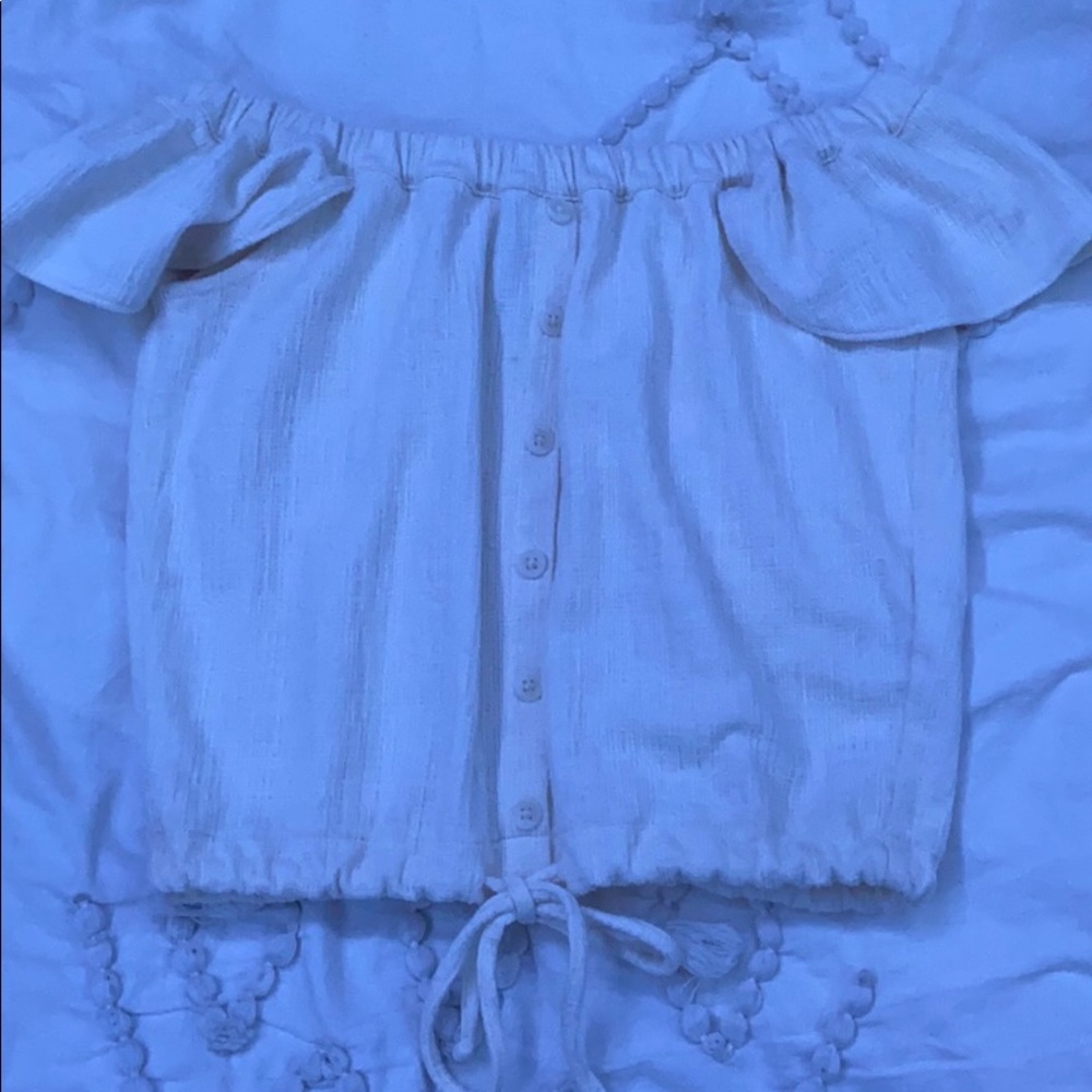 White off the shoulder blouse with a jaw string